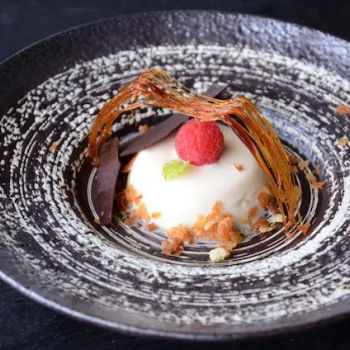 Raspberry Panna Cotta with Tempered Chocolate in Caged Caramel Dome