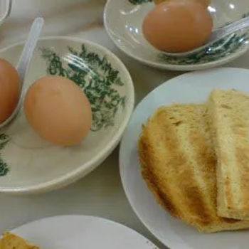 Half boiled eggs comes with two slices of toast