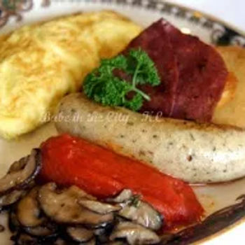 Omelette with the additional accompaniments from Two Eggs Any Style. The omelette has aged brie, smoked salmon and chives.