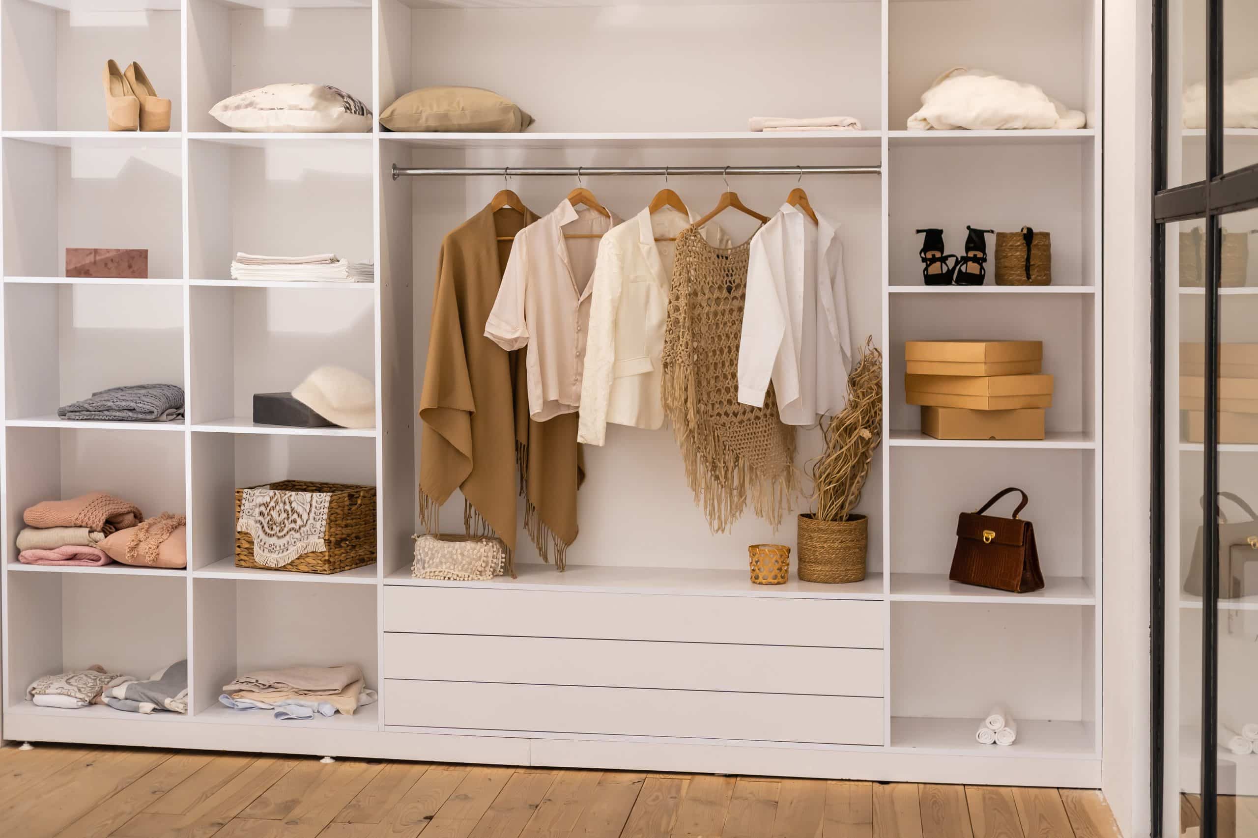 clothes hanging rail white wardrobe with boxes scaled