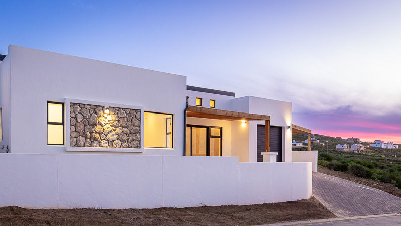 Edited twilight photo of a coastal home in St. Helena Bay with balanced lighting, richer colors, and distractions removed.