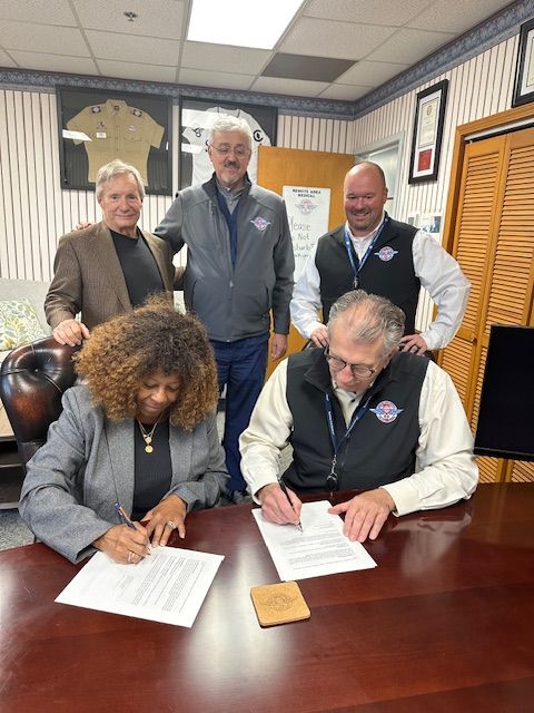 Leadership team at partnership signing