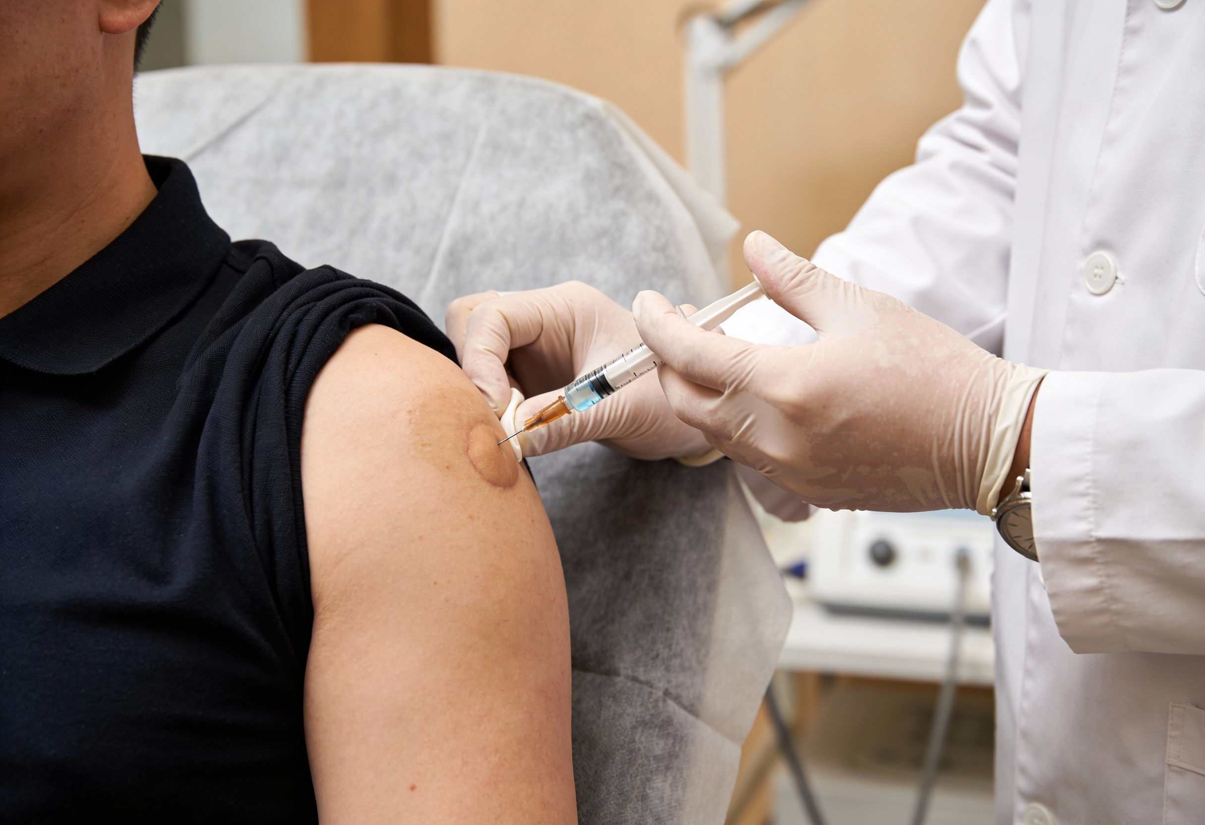 Doctor performing Prolozone therapy injection for chronic shoulder pain