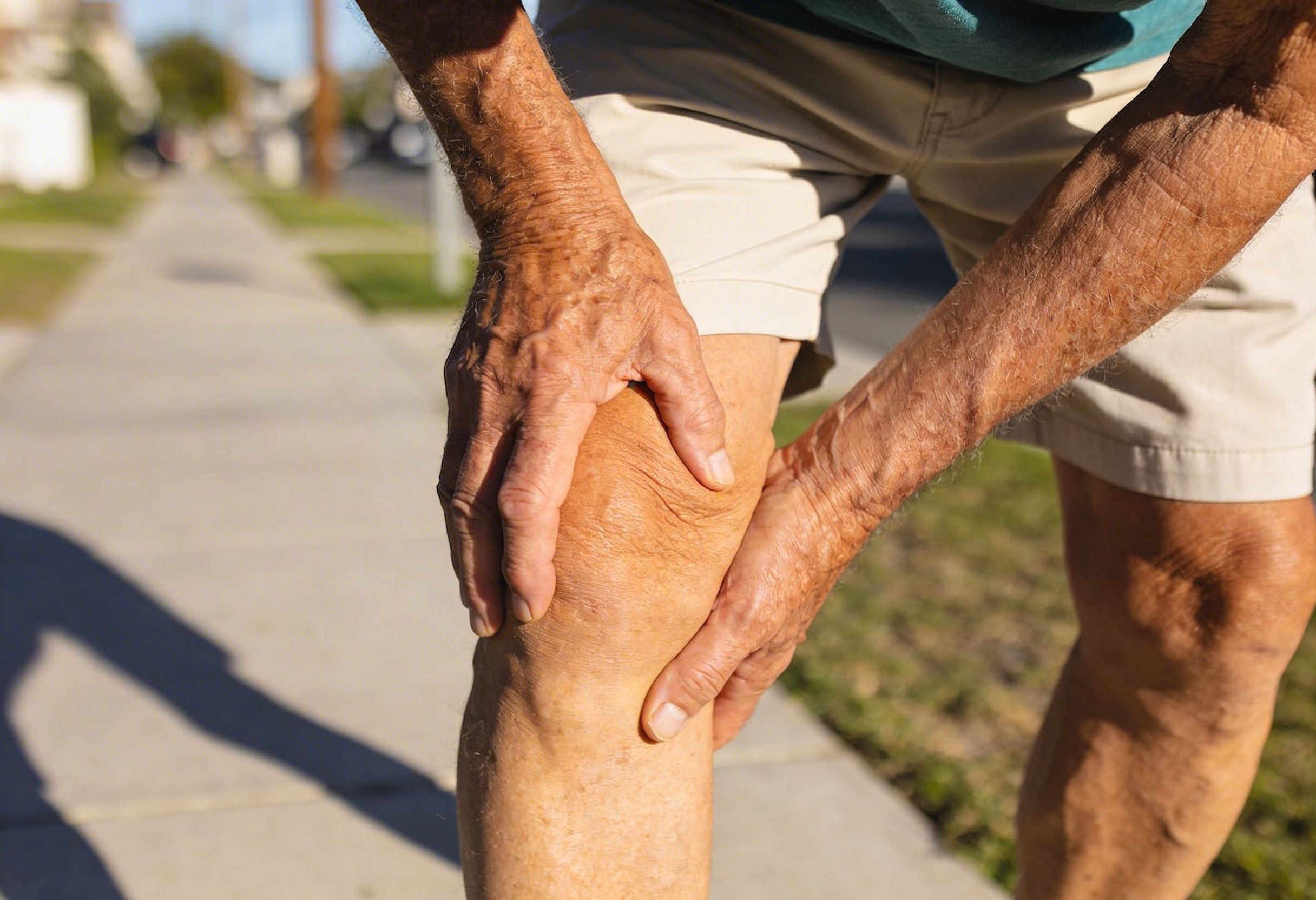 Person experiencing leg pain while walking due to peripheral artery disease