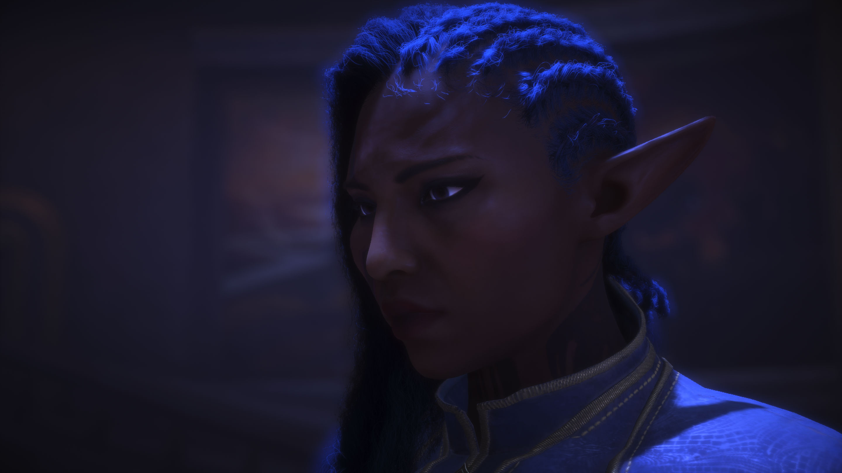 a black woman with blue hair and pointy ears