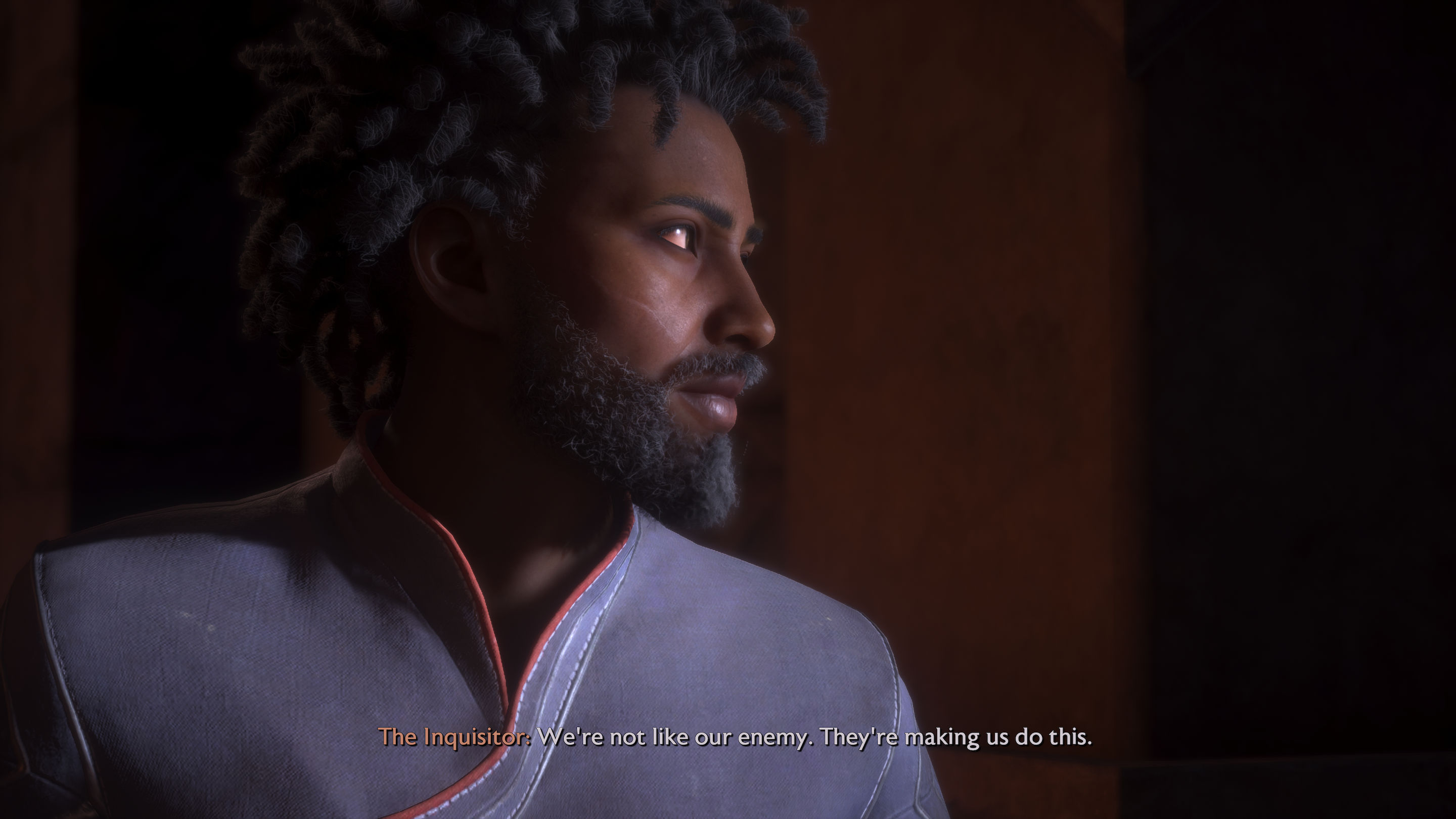a black man with long hair looking to the side