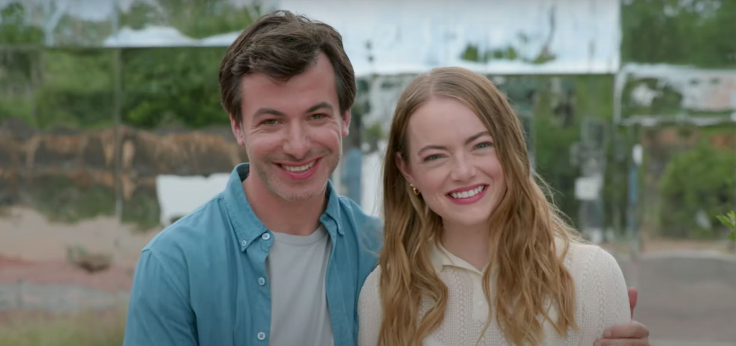 a caucasian couple smiling eerily