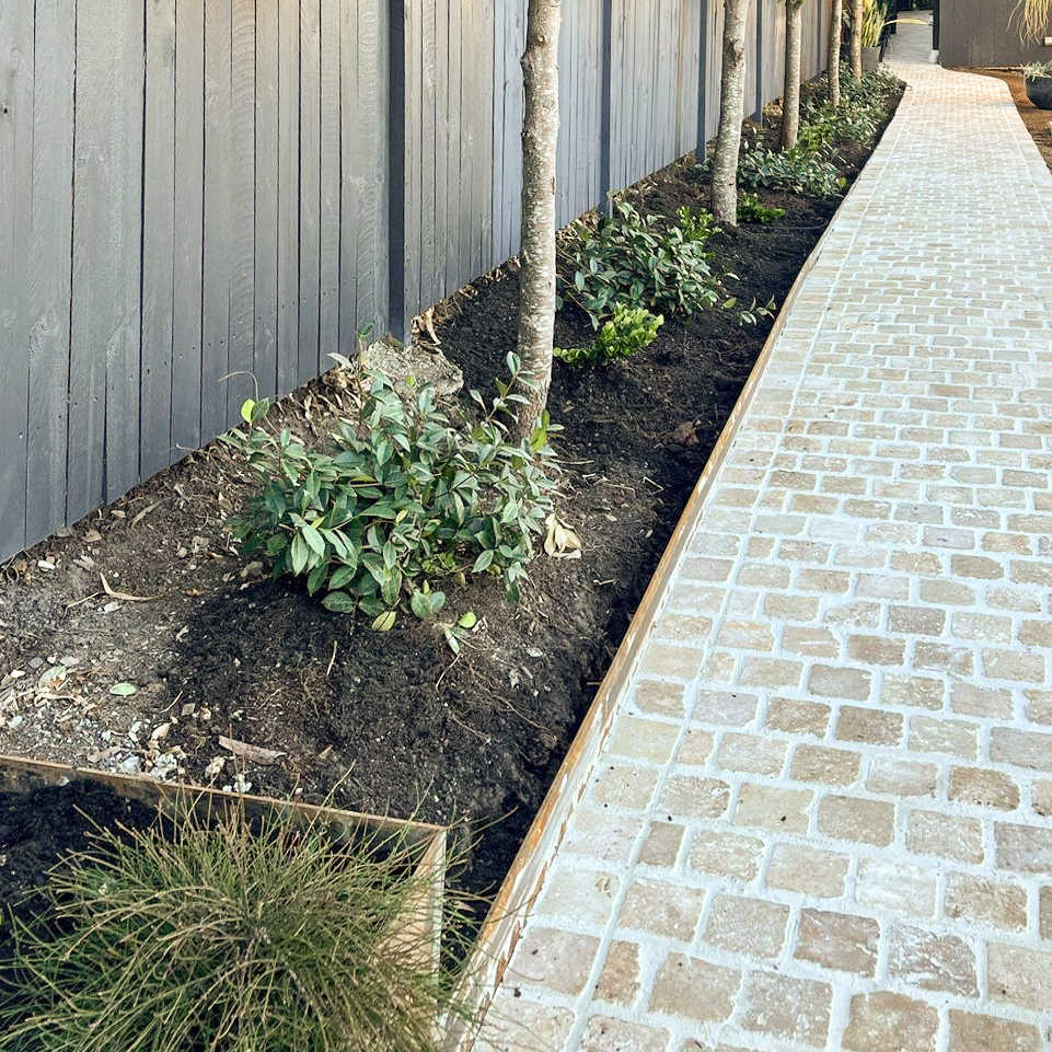 GatherCo Ironwood Project Travertine Cobblestones LuxeLandscaping