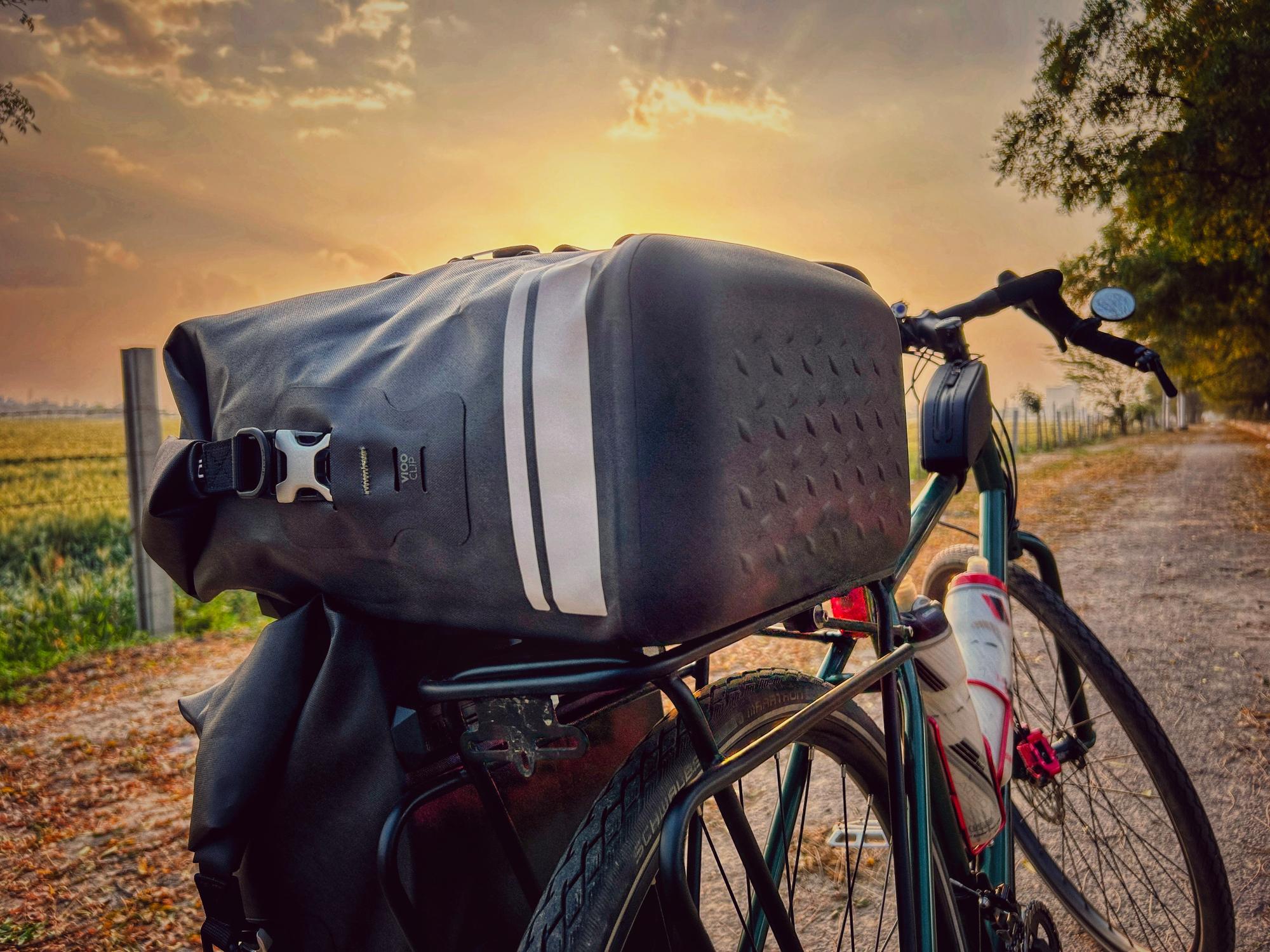 The long road home – panniers silhouetted against the setting sun