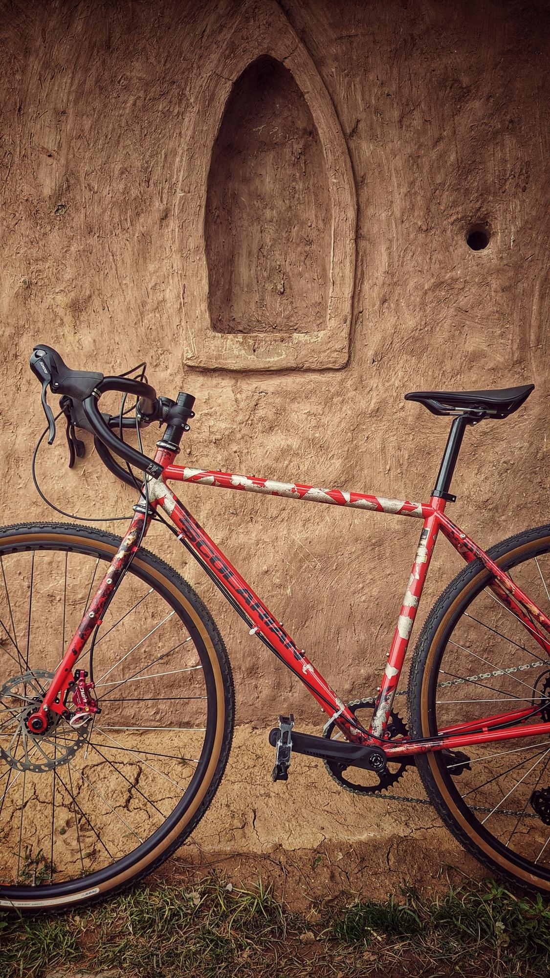 First glimpse: the Mudfest leans quietly against a dhaba wall, waiting to be noticed