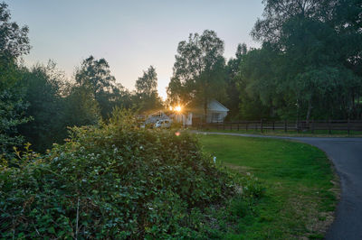 A country house at sunset. Escape to the tranquil countryside, where nature's beauty surrounds you.