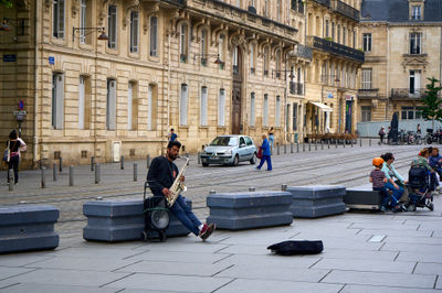 Bordeaux, France, 05.23.2023 A saxophone player on a square near Cathédrale Saint-André (Cathedral of St Andrew)