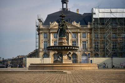 Bordeaux, France, 05.23.2023 Les Trois Grâces - Place de la Bourse Fountain. Fine details and a tranquil fountain add elegance to this iconic landmark.