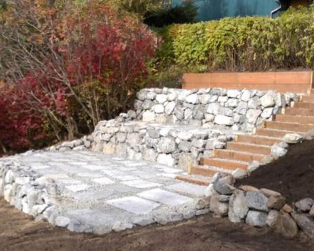 Natural rock retaining wall by Titan LLC in Anchorage Alaska