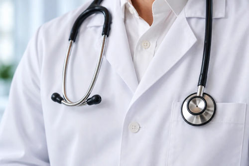 A doctor's white coat and stethoscope.