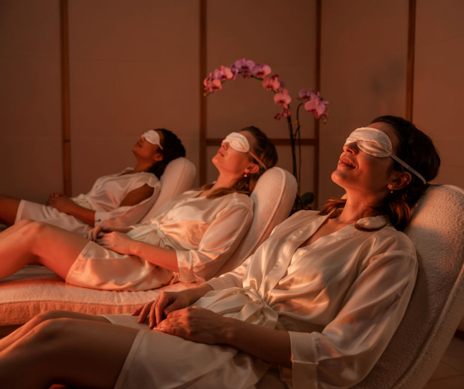 Guest receiving red light therapy in luxury wellness suite