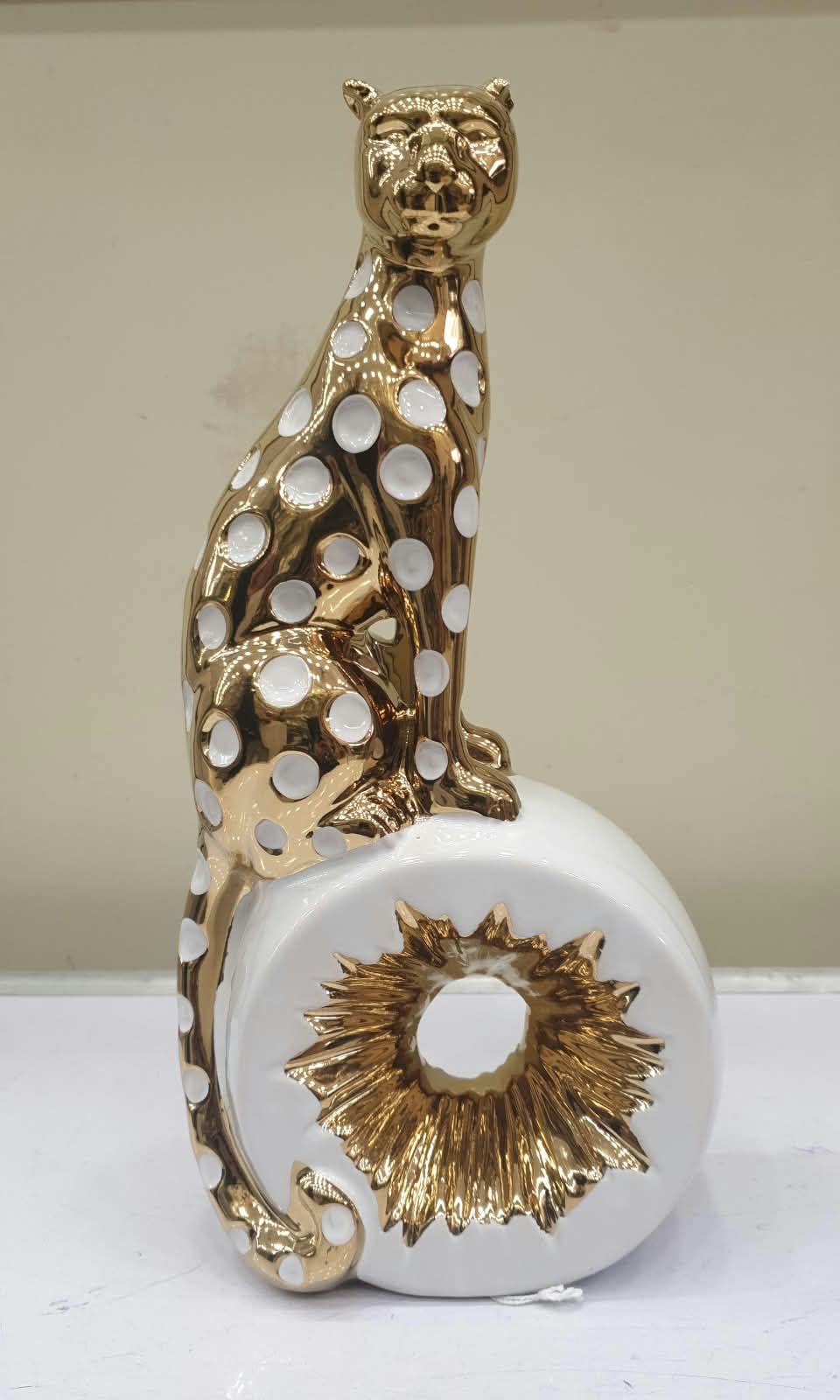 Gilded Elegance: Sitting Cheetah Home Décor Accent