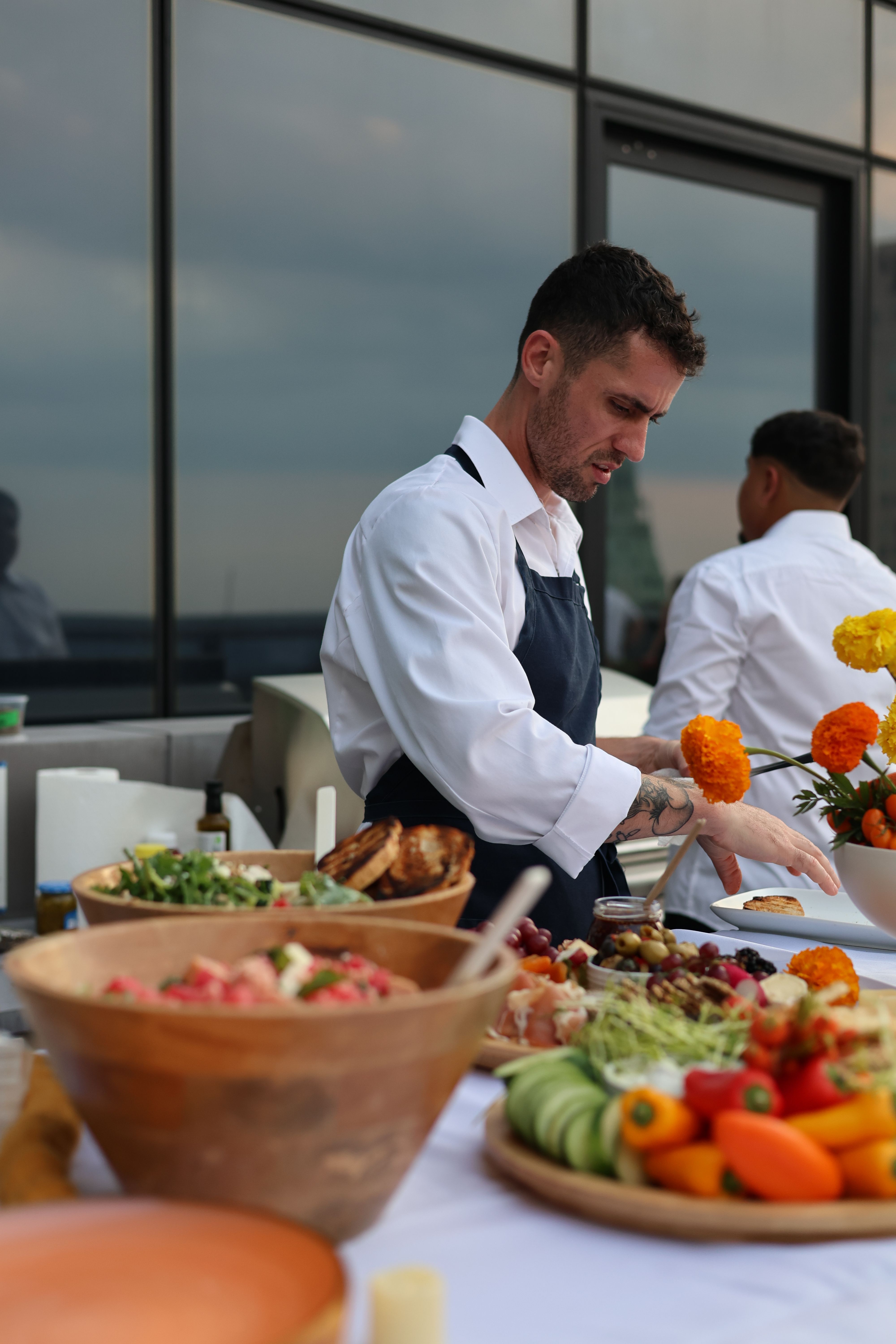 Chef Chris hosting a rooftop dinner event