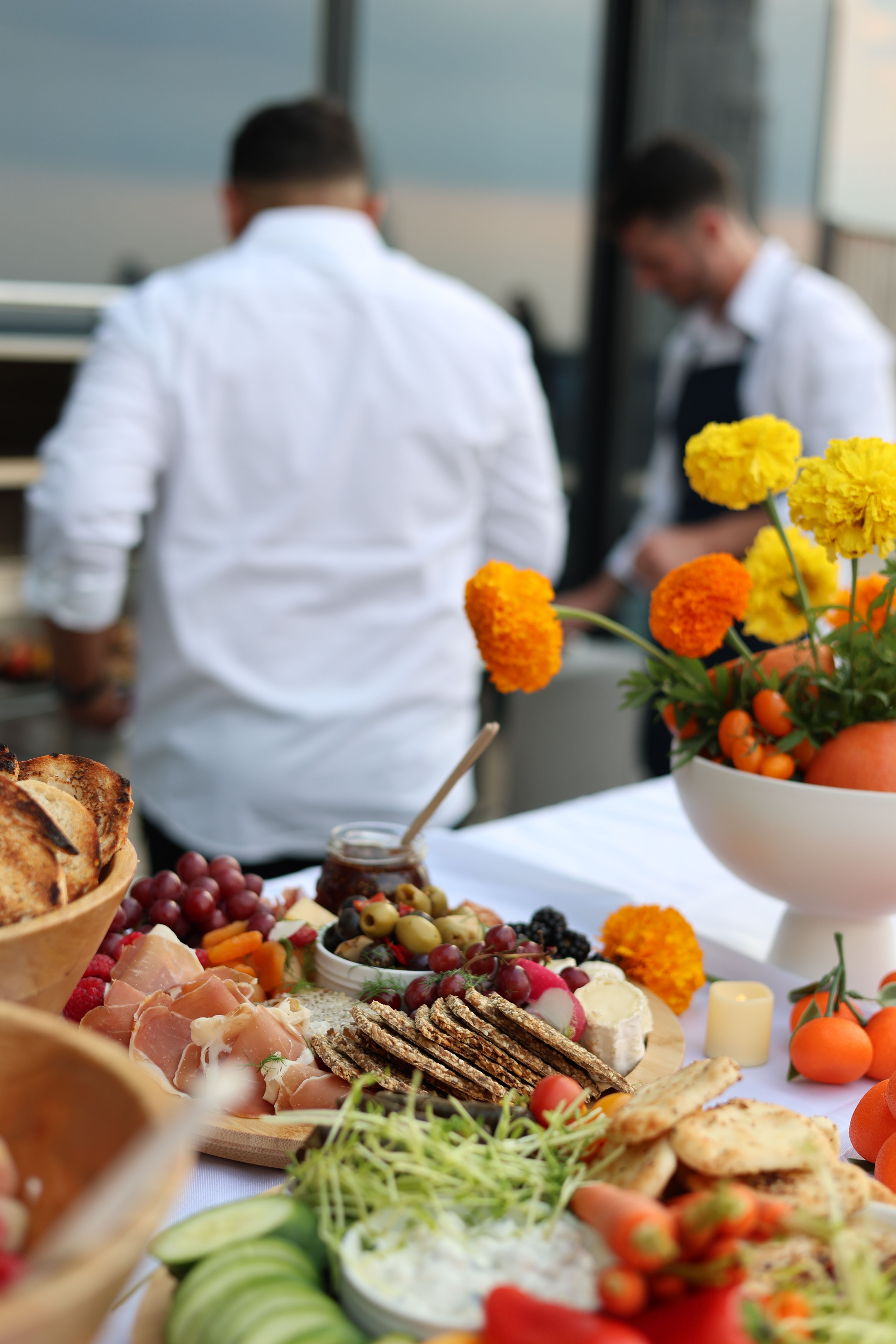 Private chef team preparing dinner on a New York rooftop