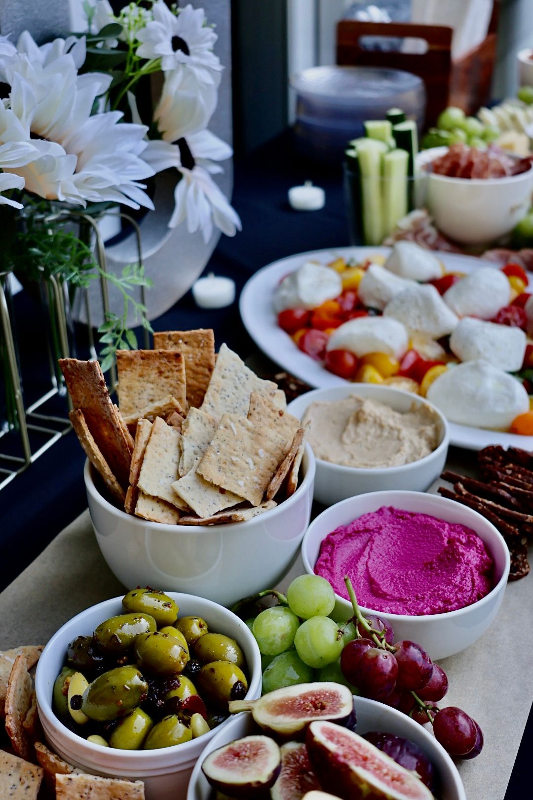 Grazing table with cheeses, meats and fresh produce