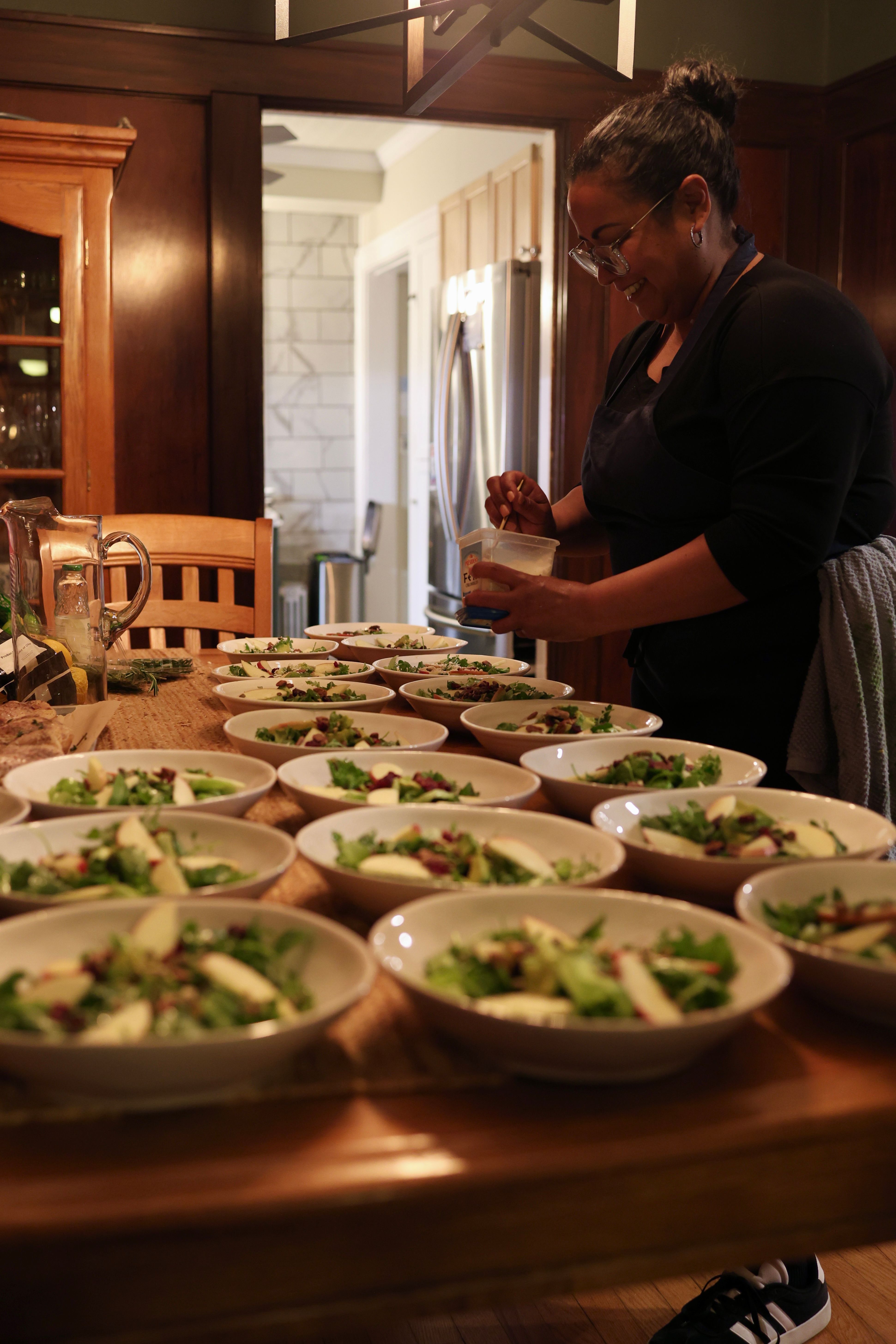 Team member plating seasonal salad