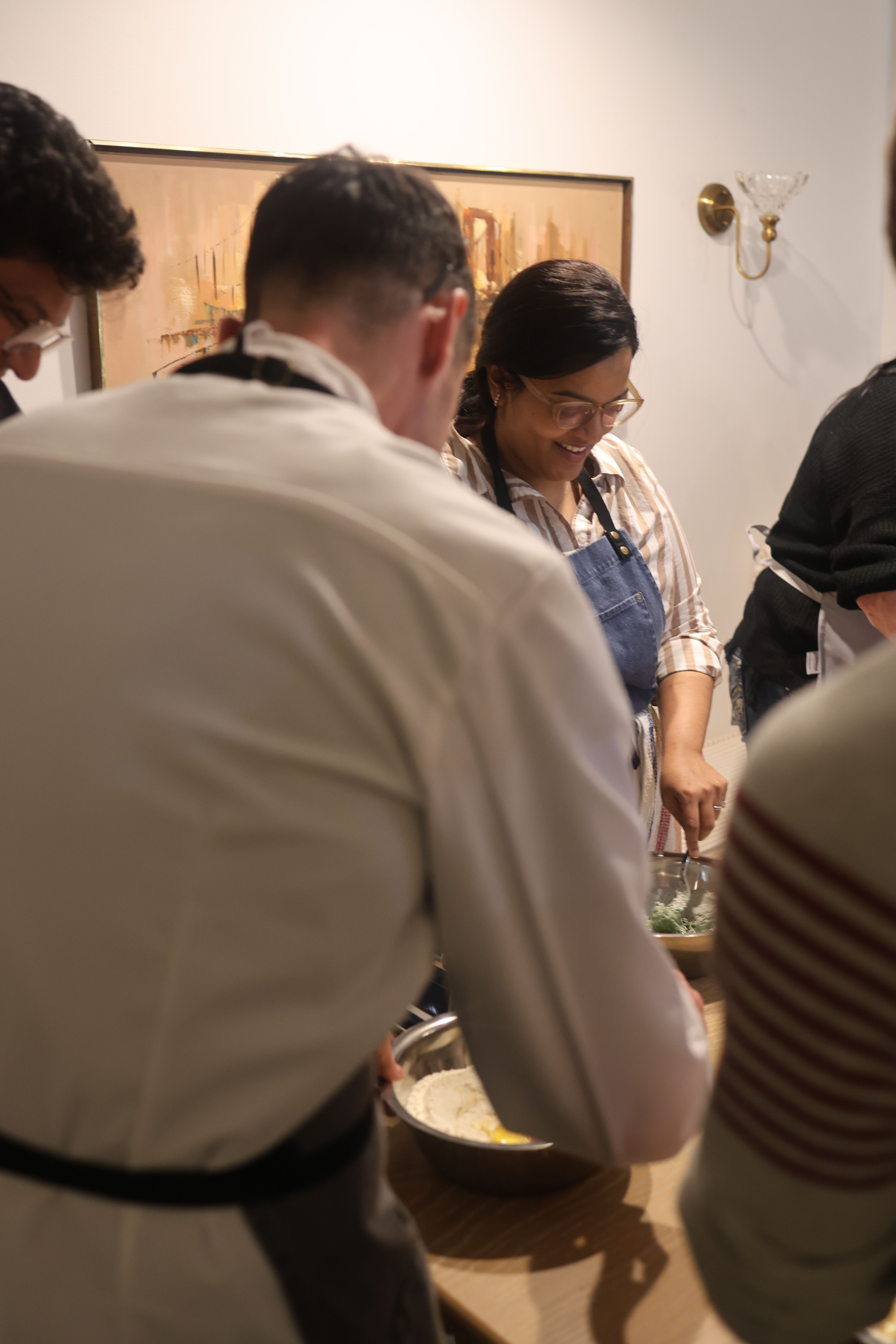 Rolling and shaping pasta during class