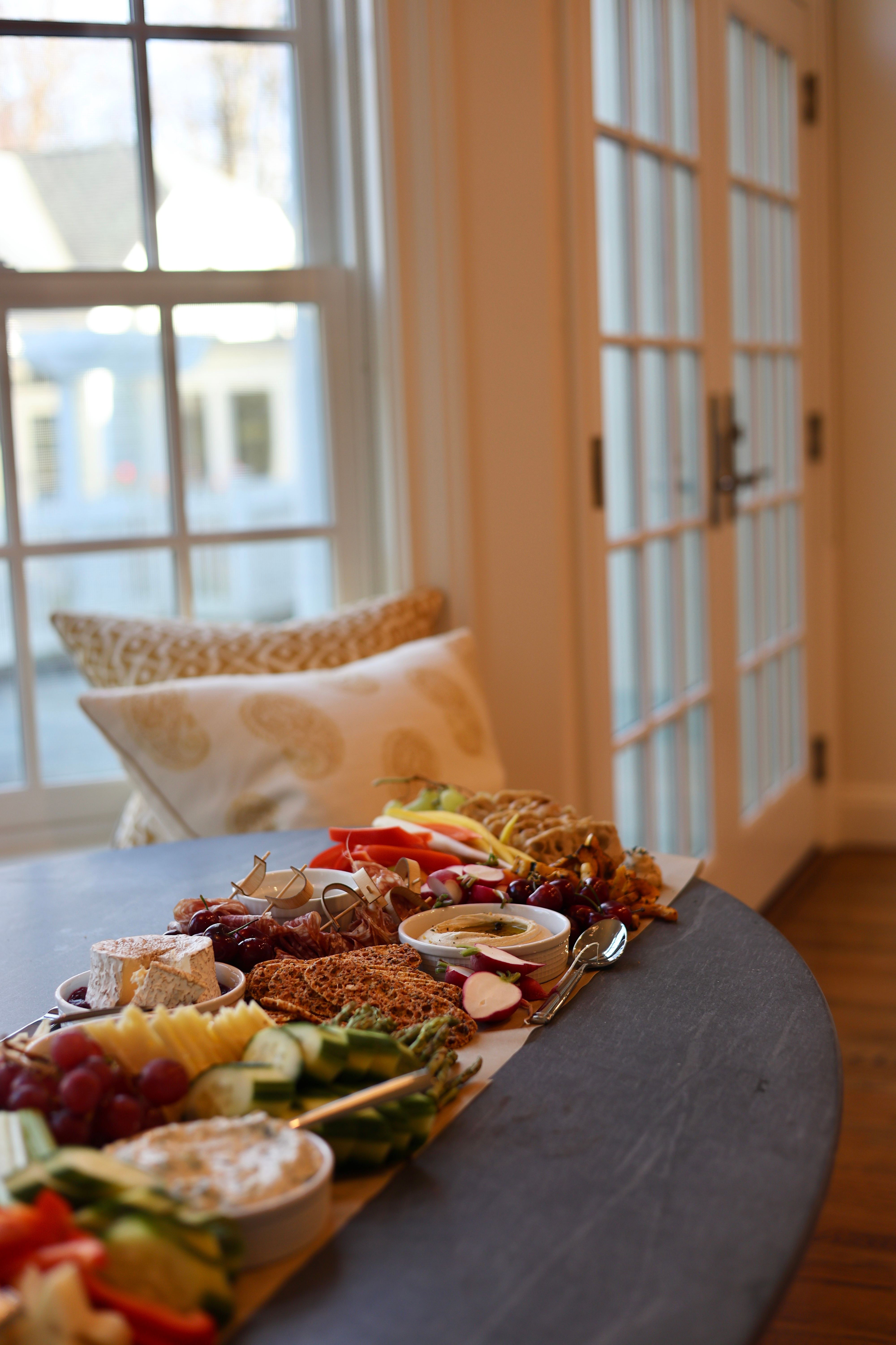Additional grazing table with charcuterie and fresh fruit