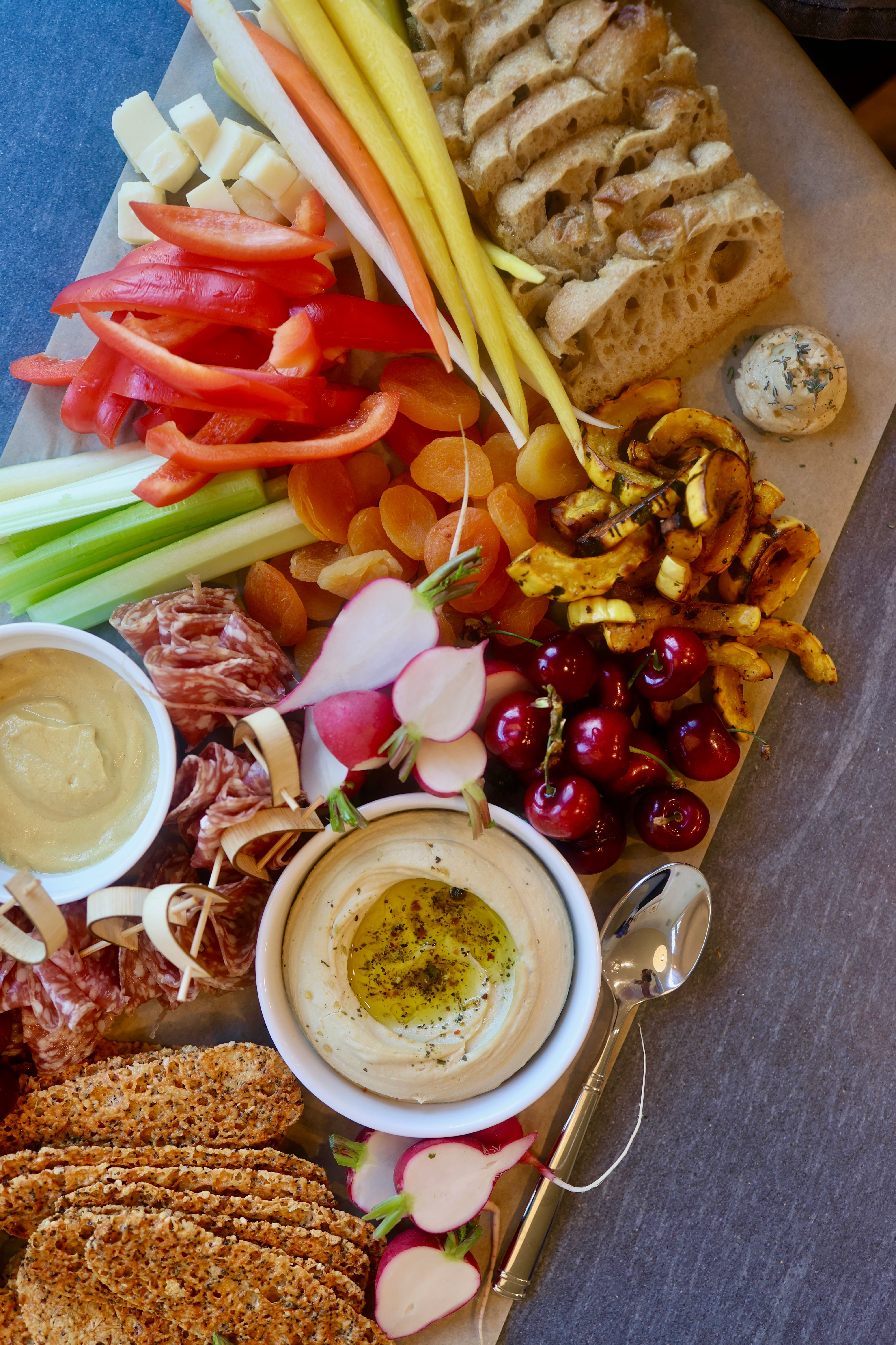 Large grazing table setup with charcuterie and accompaniments