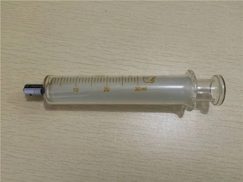 Glass Syringes with Luer Lock - Various Sizes for Laboratory Use High-quality glass syringes with Luer lock fittings available in multiple sizes for laboratory experiments and sampling. High-quality glass syringes with Luer lock fittings available in multiple sizes for laboratory experiments and sampling. Glass Syringes with Luer Lock - Various Sizes for Laboratory Use