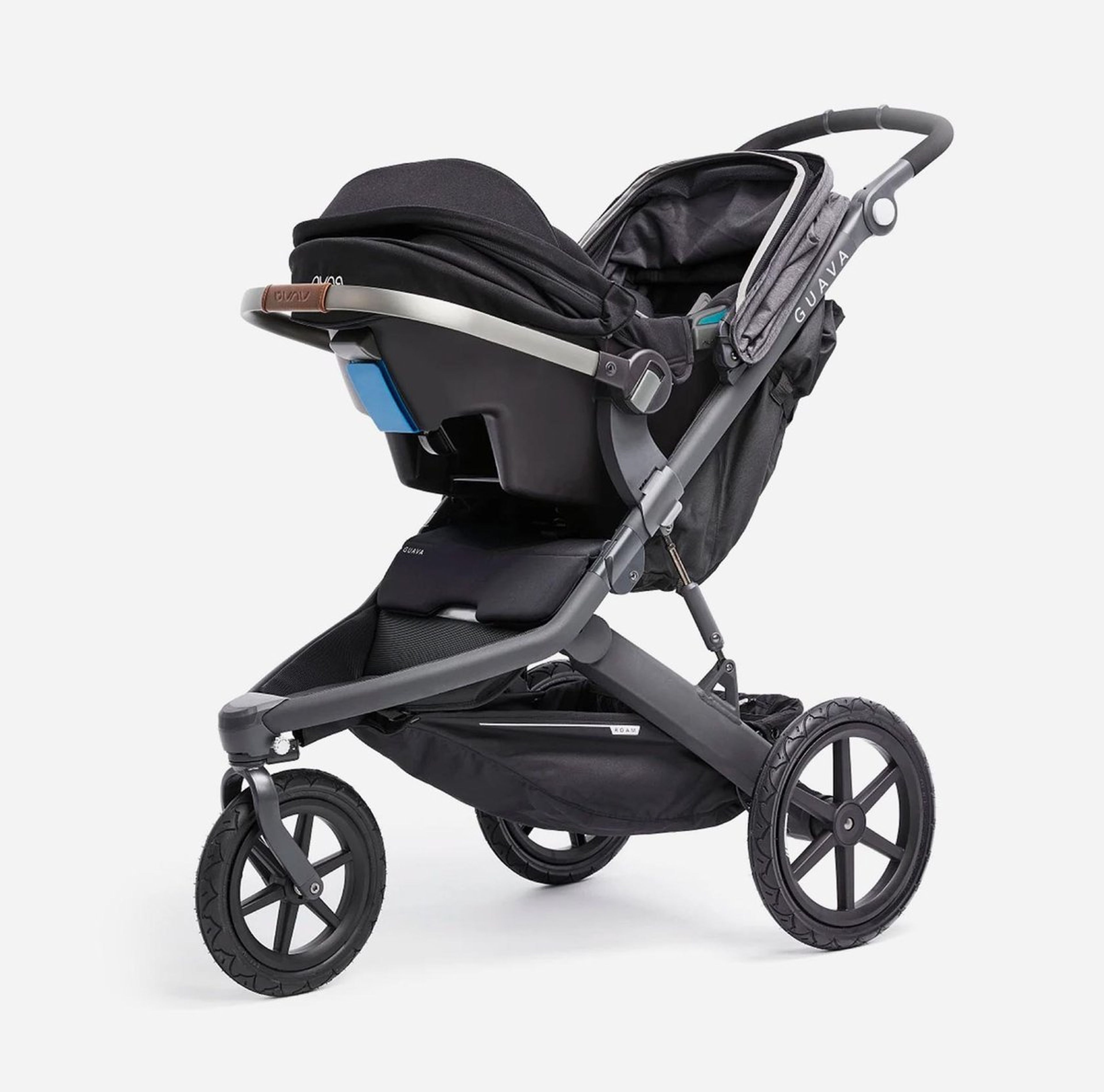 A modern stroller with a black seat and a silver frame, viewed from the side.