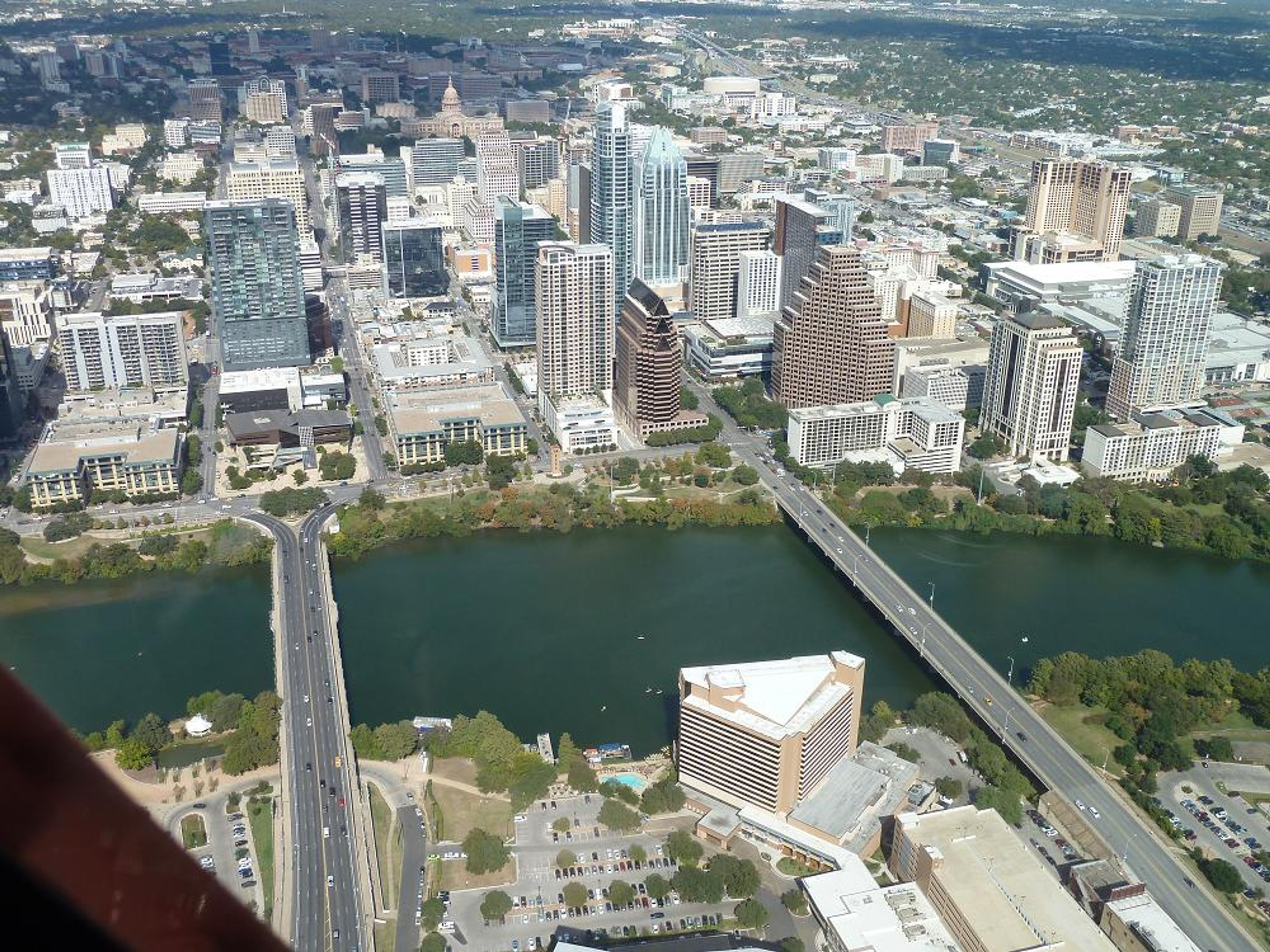 Aerial view of downtown Austin with buildings and a river.