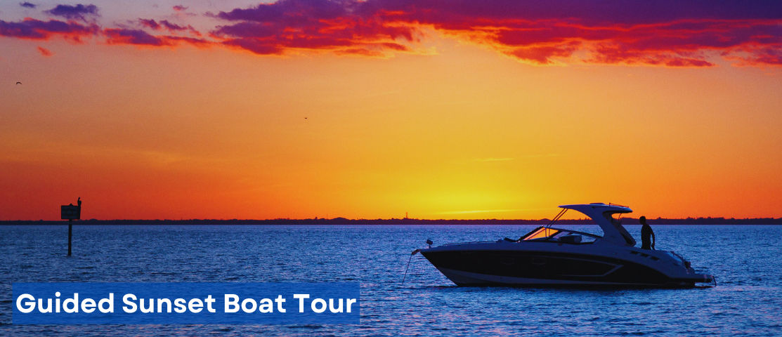 Boat cruising through Biscayne Bay at sunset with Miami skyline in the background