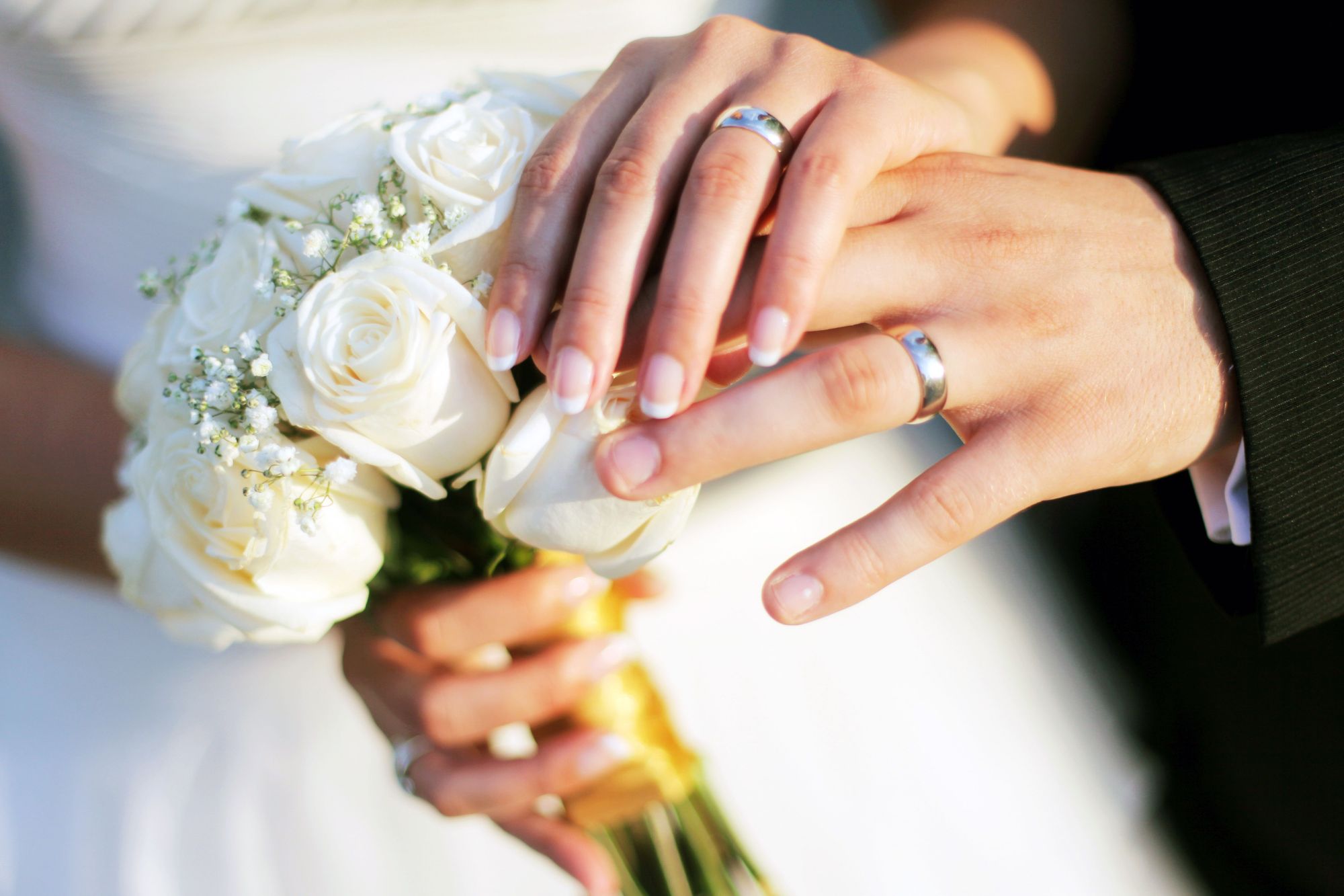 Holding hands at a wedding in Kelowna, British Columbia 