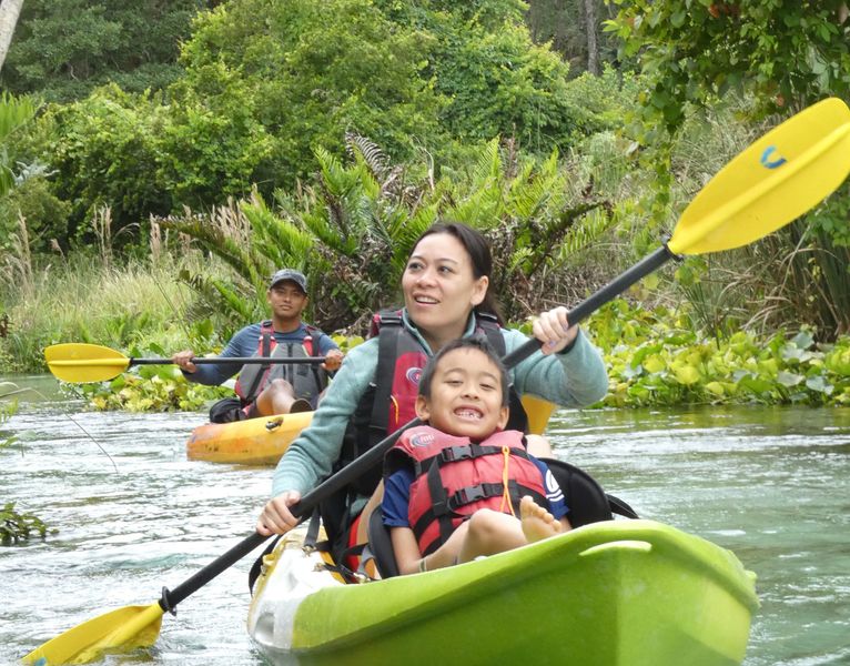 Family enjoying a peaceful kayak tour along the crystal clear waters.