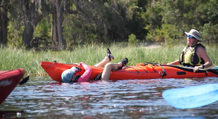 Instructor demonstrating a swimmer rescue.
