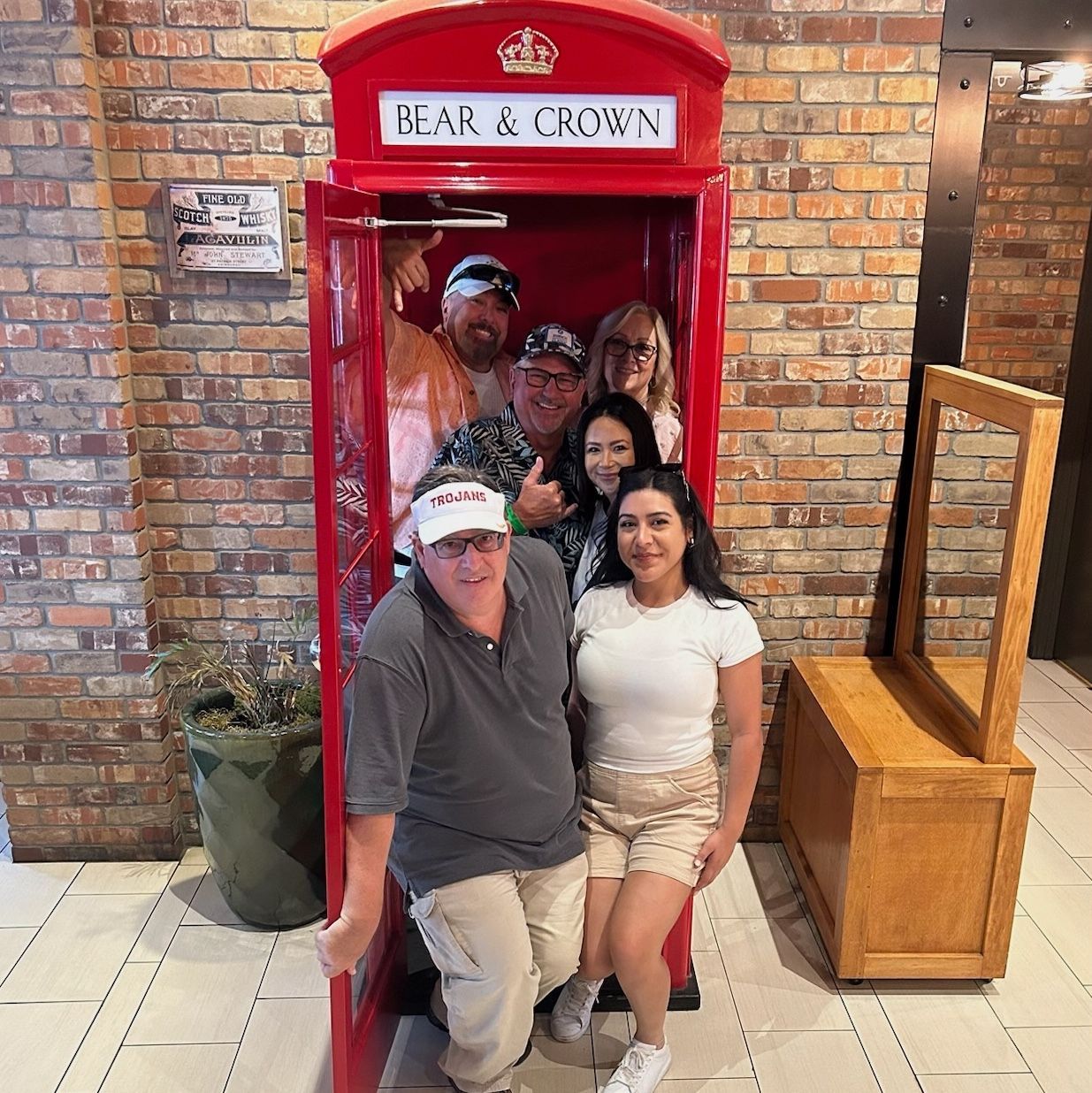 group in a red phone booth