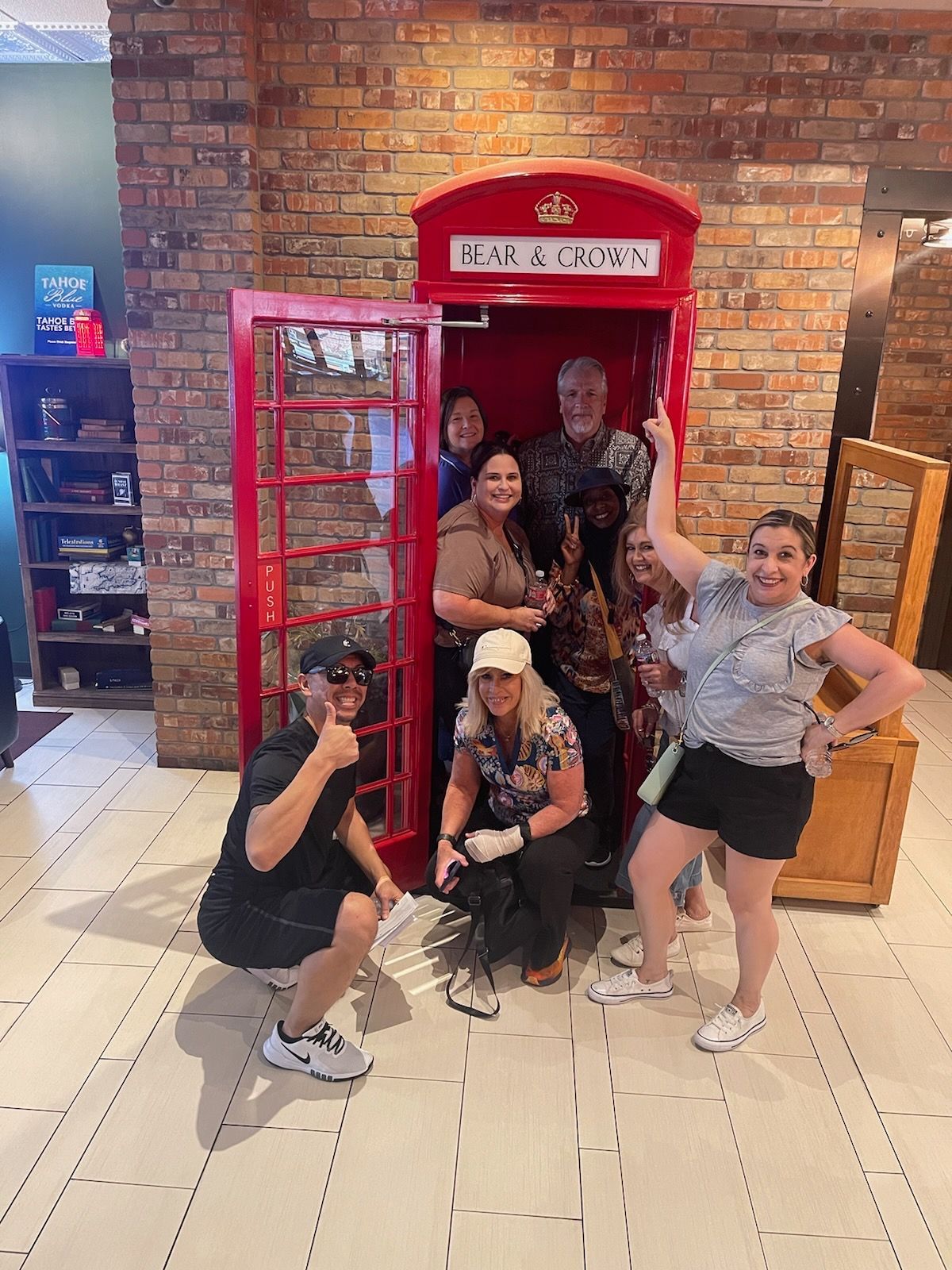 people in front of phone booth