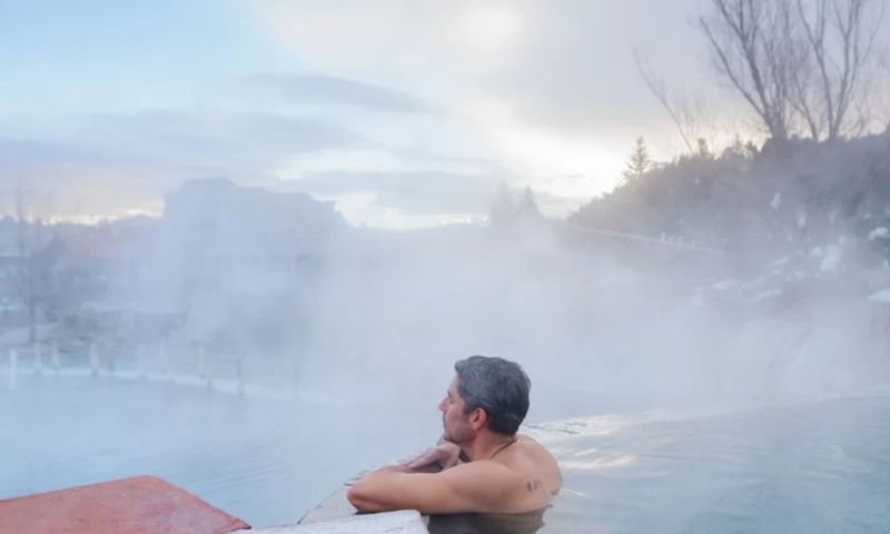 person soaking in hot springs in Pagosa Springs