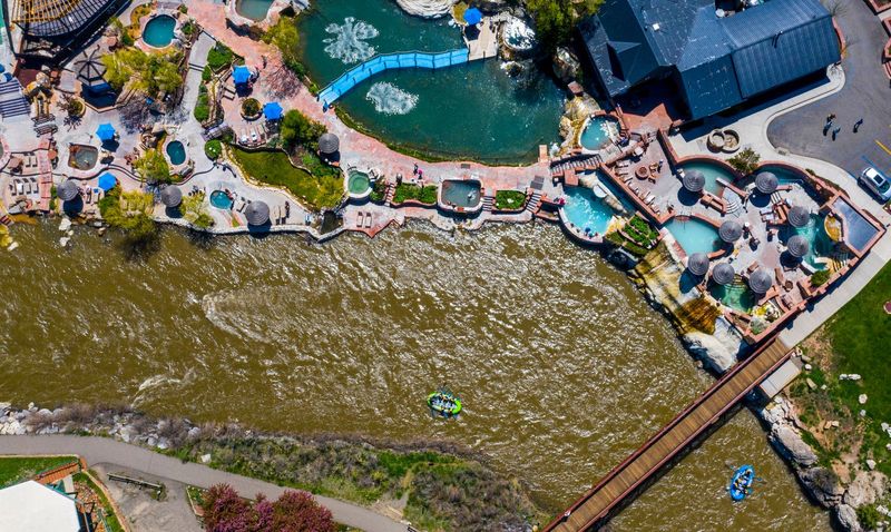 Rafters enjoy the cold water of the San Juan River while others enjoy the hot springs water at The Springs Resort