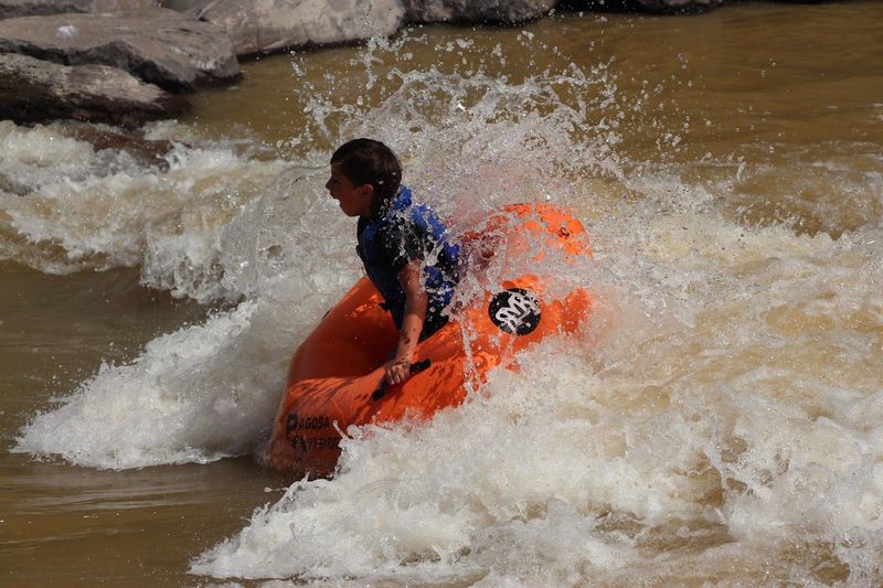 Kiddo enjoying Cotton's Hole Rapid on Pagosa Outside's Deluxe Tube Trip