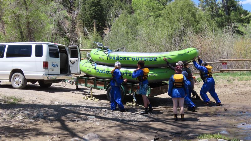 Rafters loading rafts at the Mesa Canyon River Access point