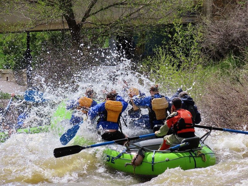 Splash and Dash Rafters blast though a wave in the Pagosa Springs Whitewater Park
