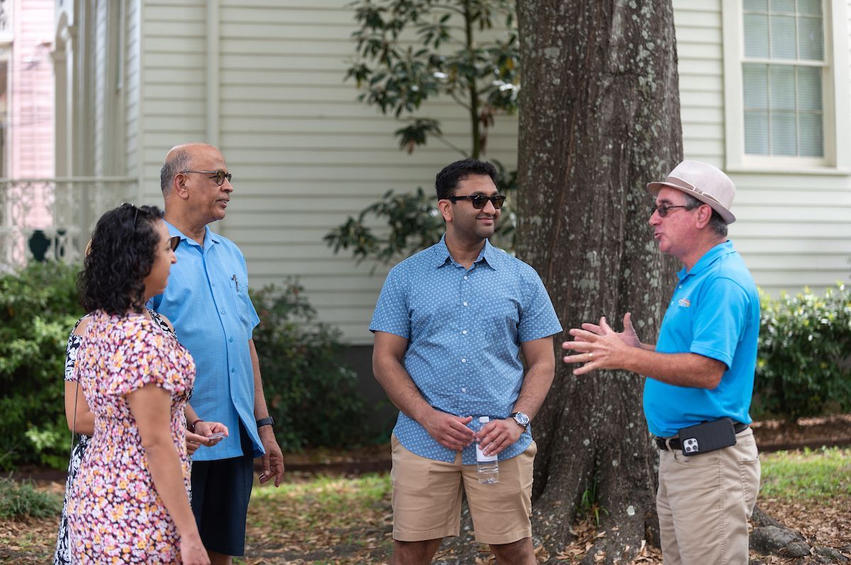 Tour guide sharing a story with guests on the Garden District tour.