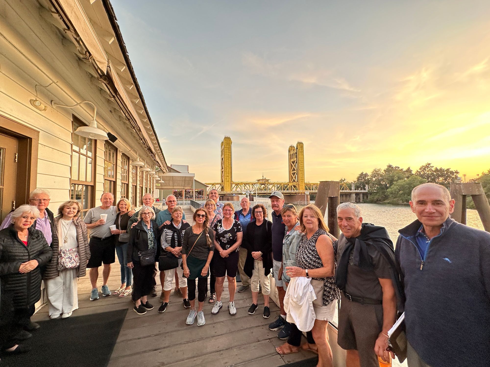 group with bridge in background