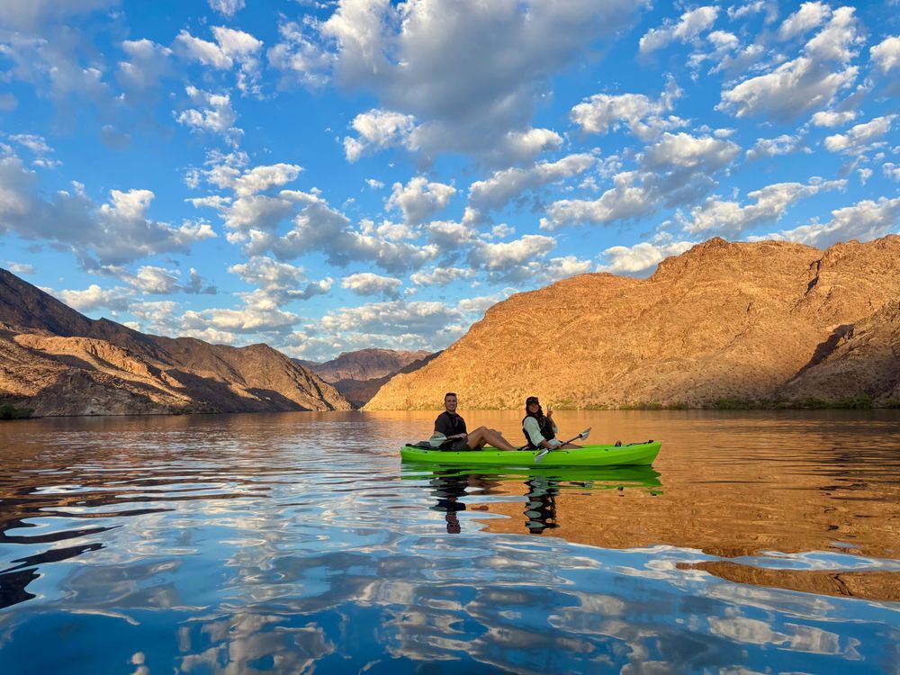 Kayakers paddling on the Colorado River near Emerald Cave during a guided and self-guided kayak tour in Black Canyon near Las Vegas.