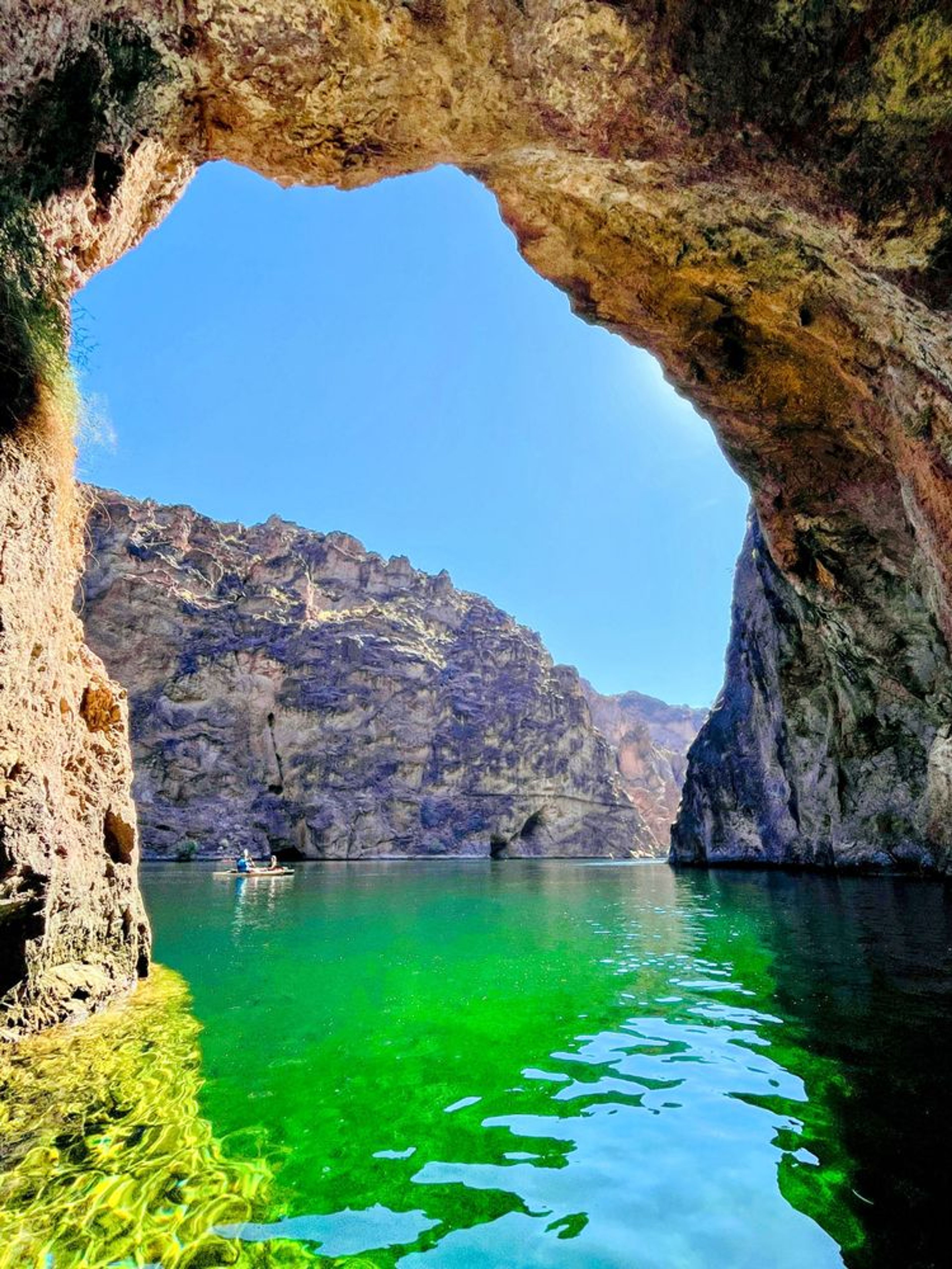 Kayakers exploring multiple caves in Black Canyon including Emerald Cave and Echo Cave