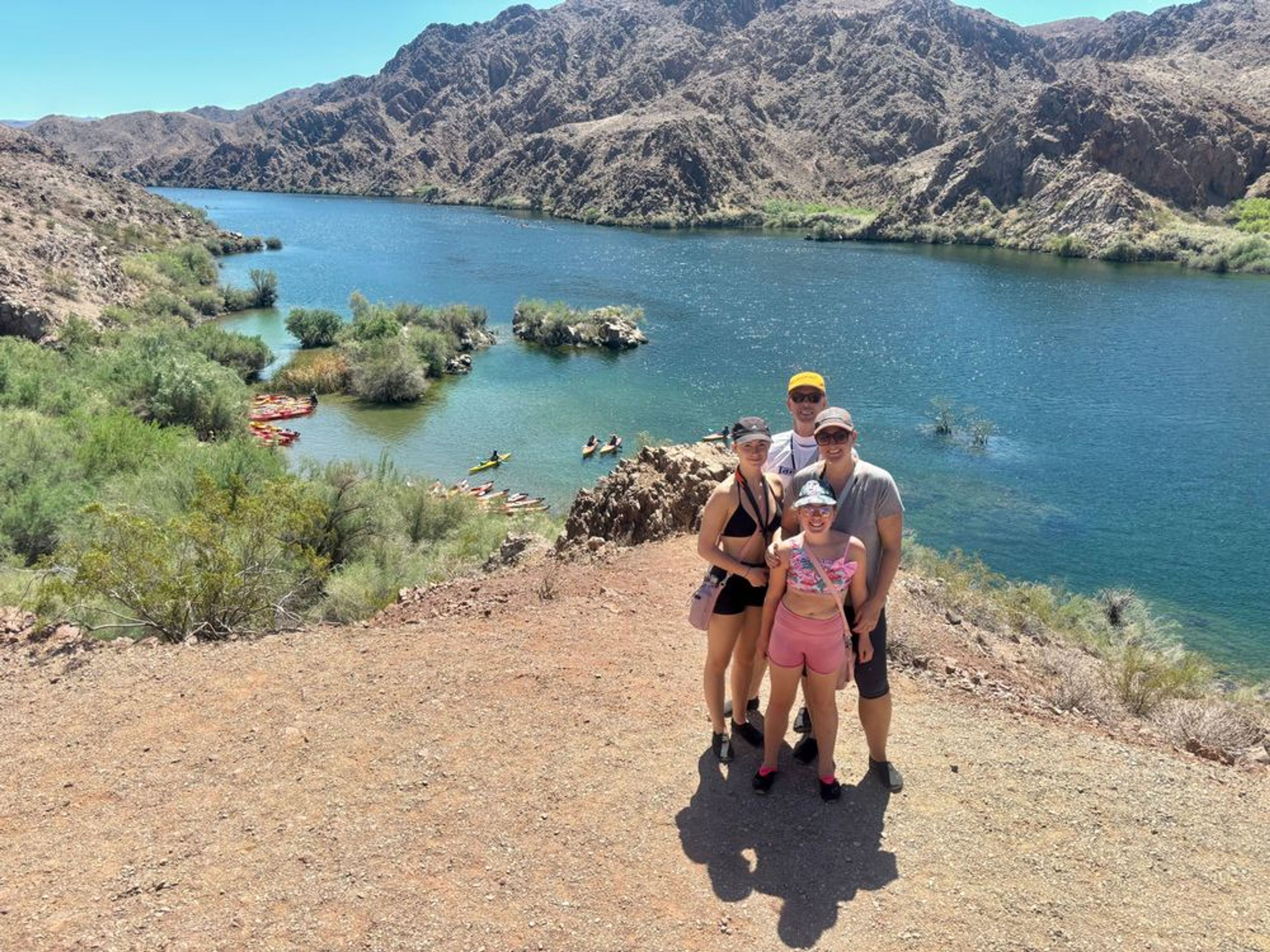 Private kayak group exploring hidden coves and scenic vistas in the Black Canyon on the Colorado River.