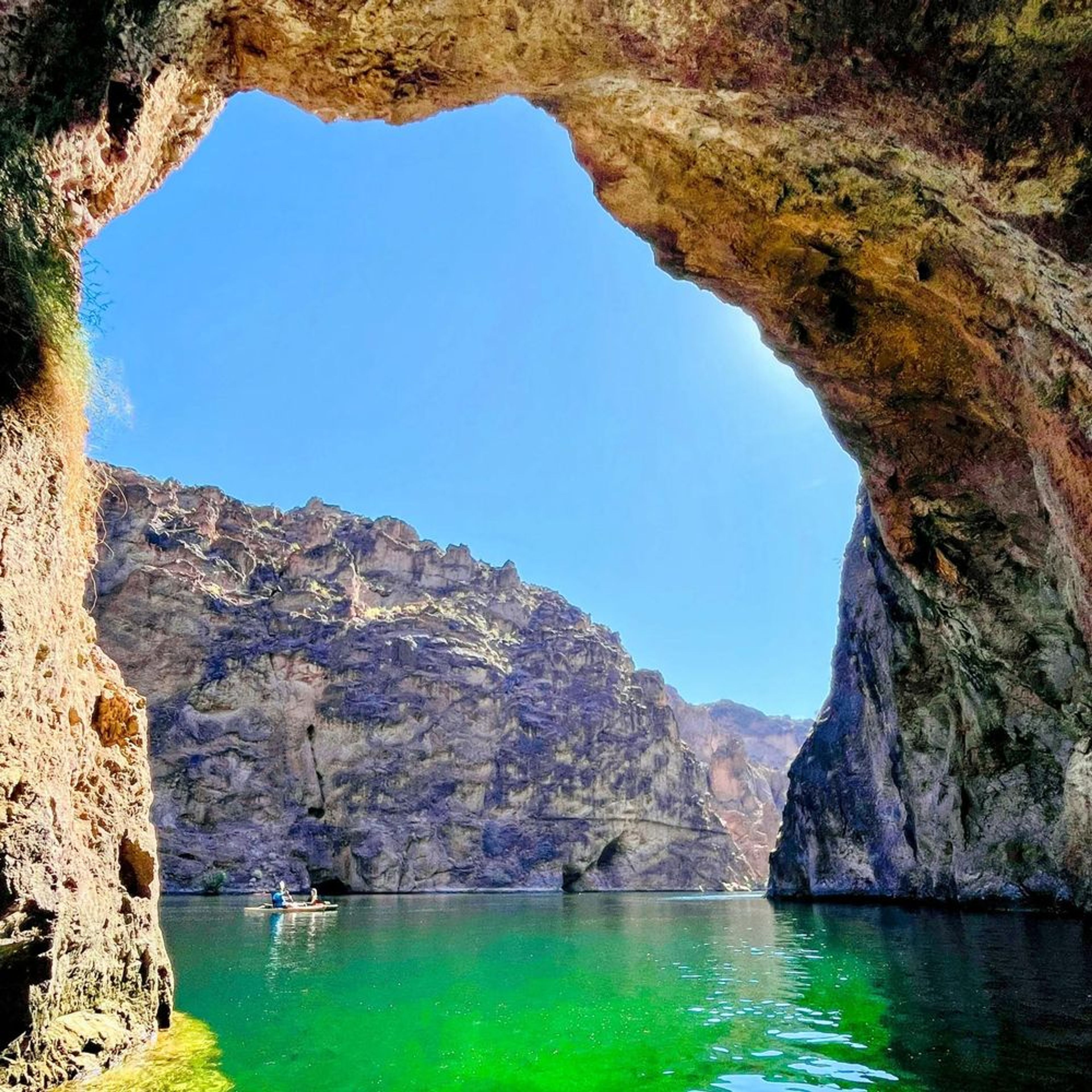 Scenic view of Emerald Cave glowing green during a kayak tour from Willow Beach