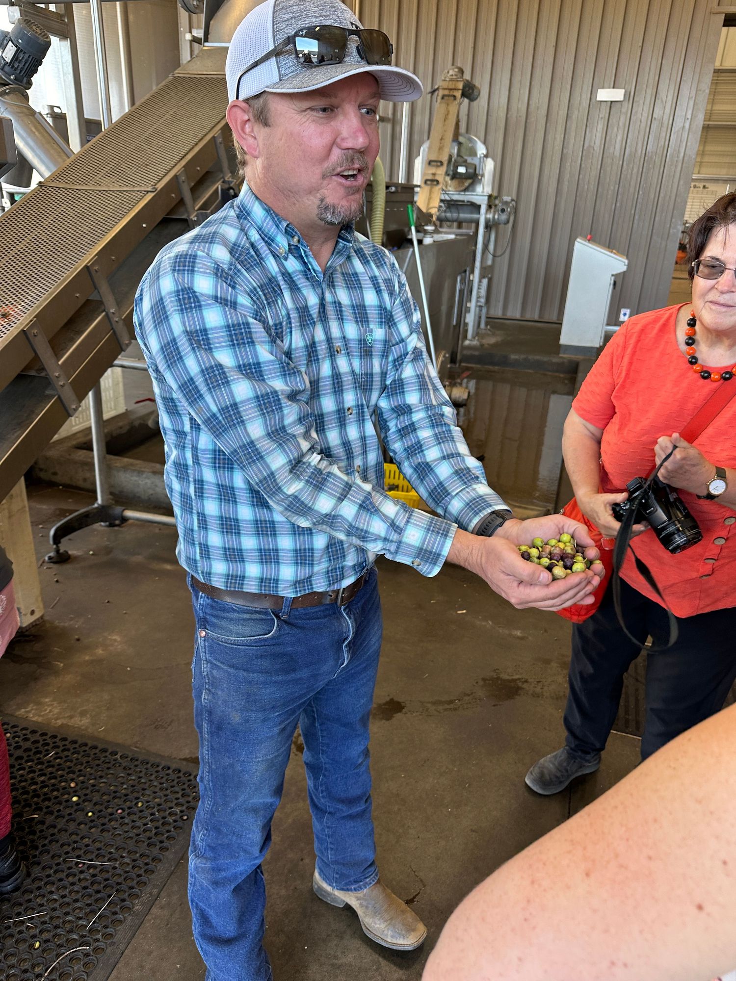 man holding olives