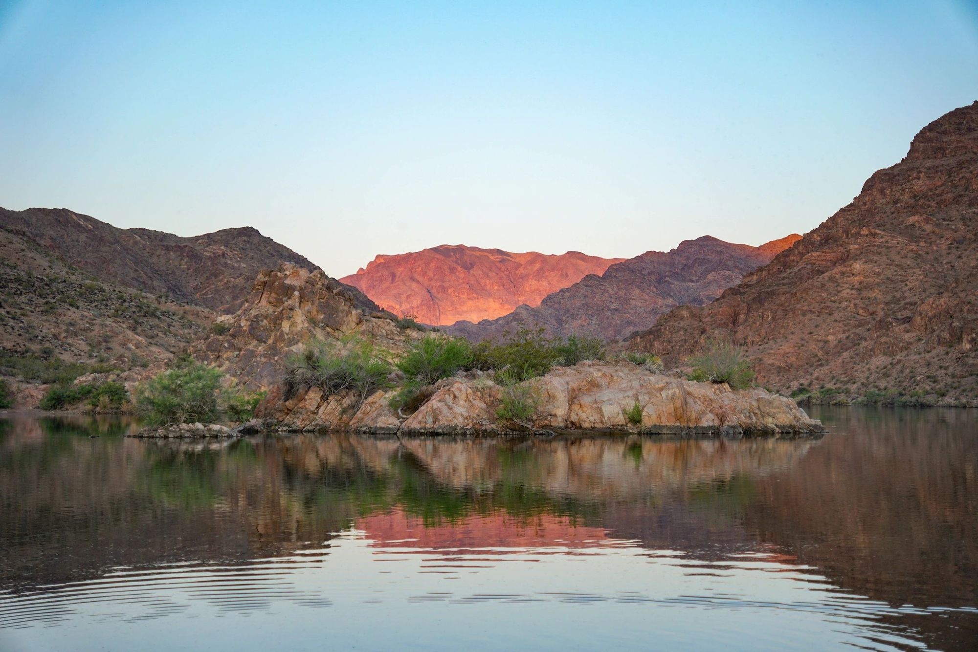 Explore secluded sections of the Colorado River surrounding by mountains and cliffs.